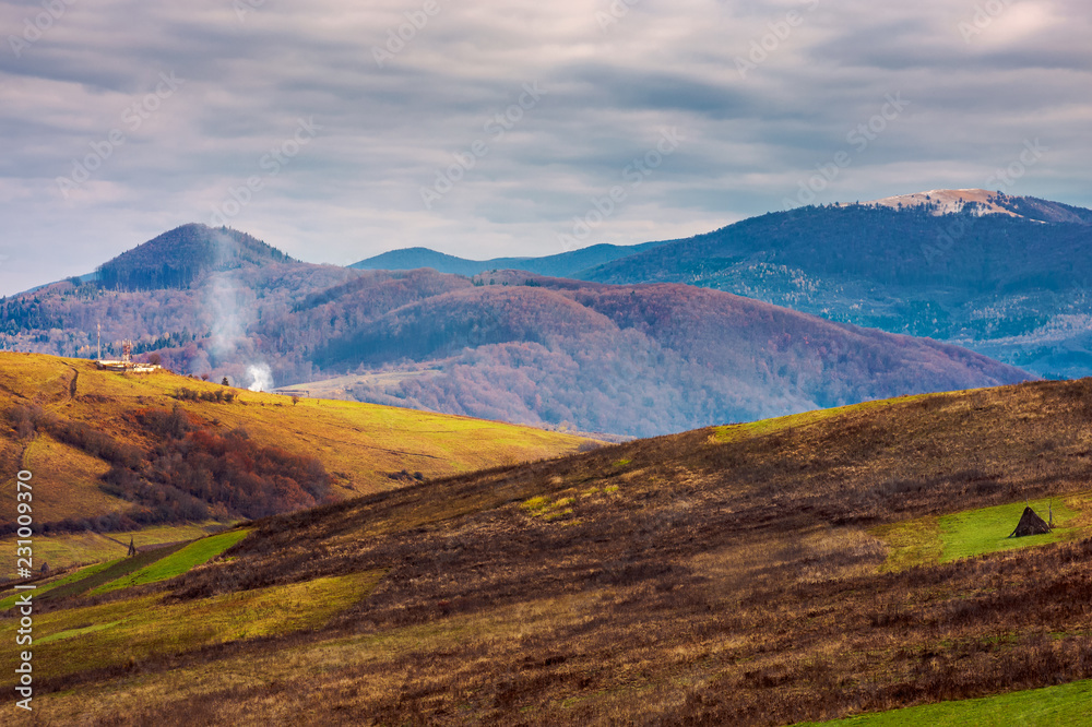 mountainous rural area in deep autumn. empty fields and leafless trees on hills. cloudy november day mountainous rural area in deep autumn. empty fields and leafless trees on hills. cloudy november day