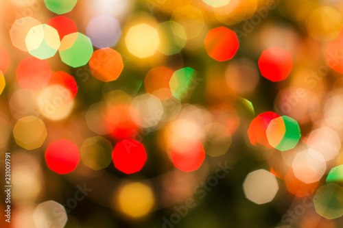 Christmas blurred background with colorful festive lights.