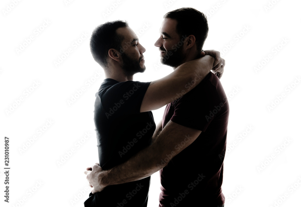 Young homosexuals shadow couple love each other on a white background. Young homosexuals shadow couple love each other on a white background.