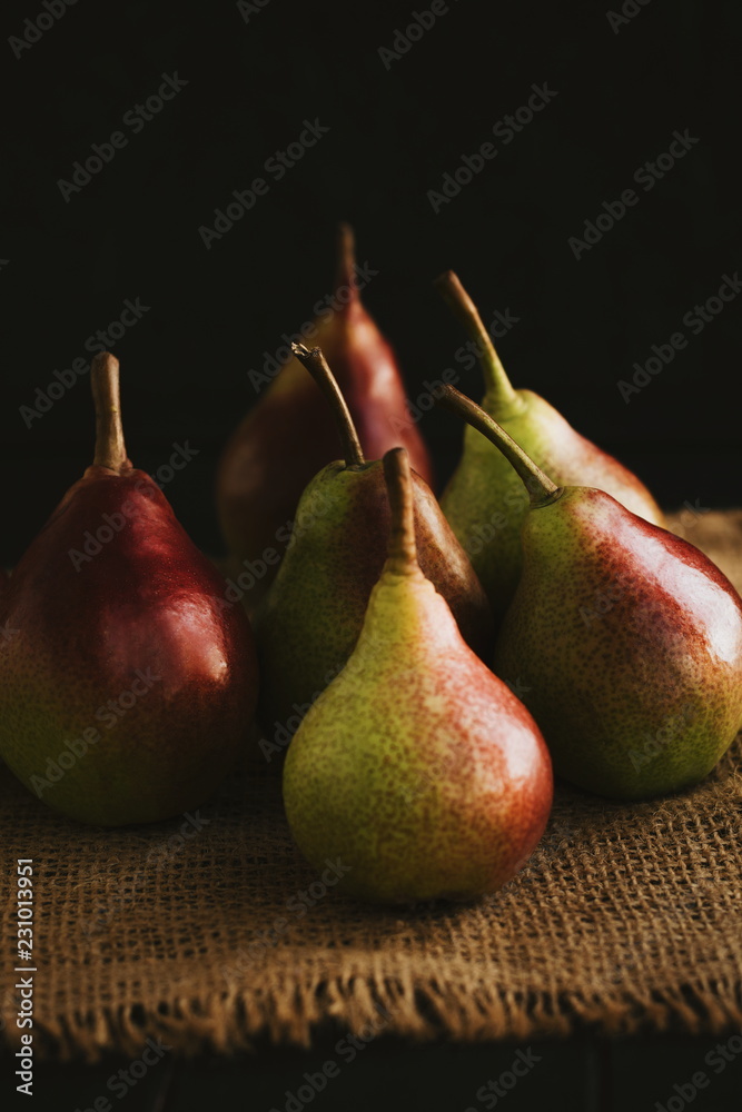 Autumn concept. Autumn leaves and fresh pears on a wooden table. Vintage style. Autumn concept. Autumn leaves and fresh pears on a wooden table. Vintage style.