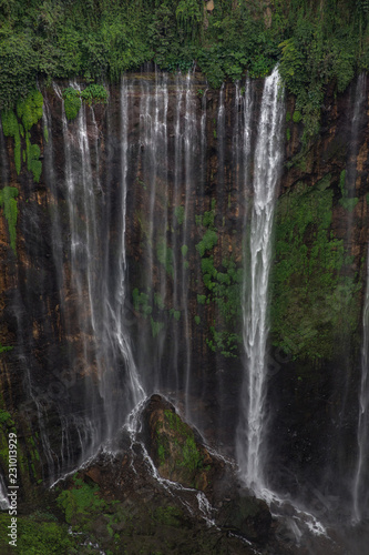 Water flows from every spot along this cliff wall at Coban Sewu in East Java, Indonesia