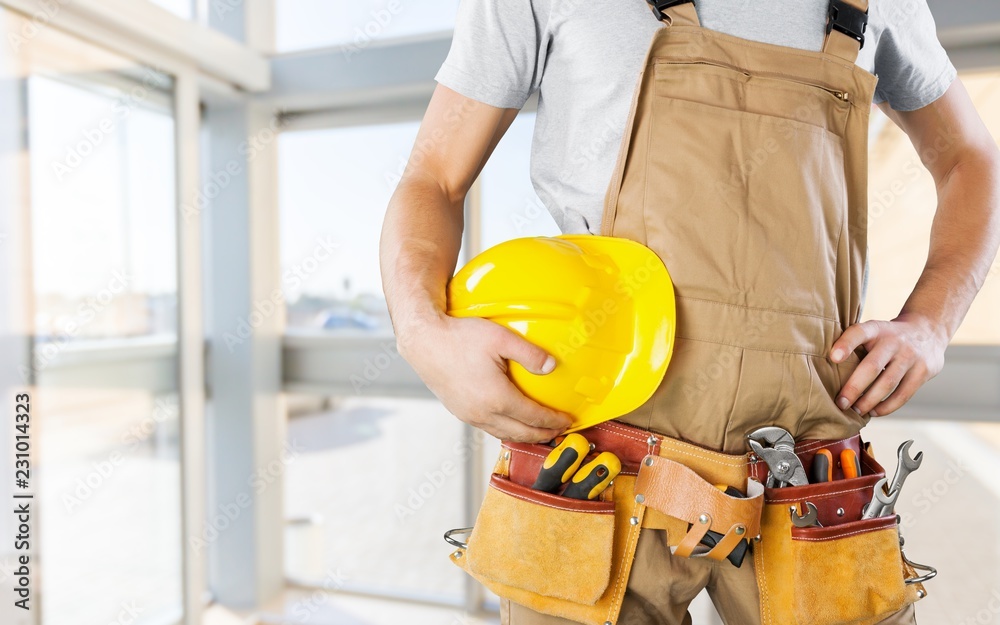 Worker with a tool belt. Isolated over background. Worker with a tool belt. Isolated over background.