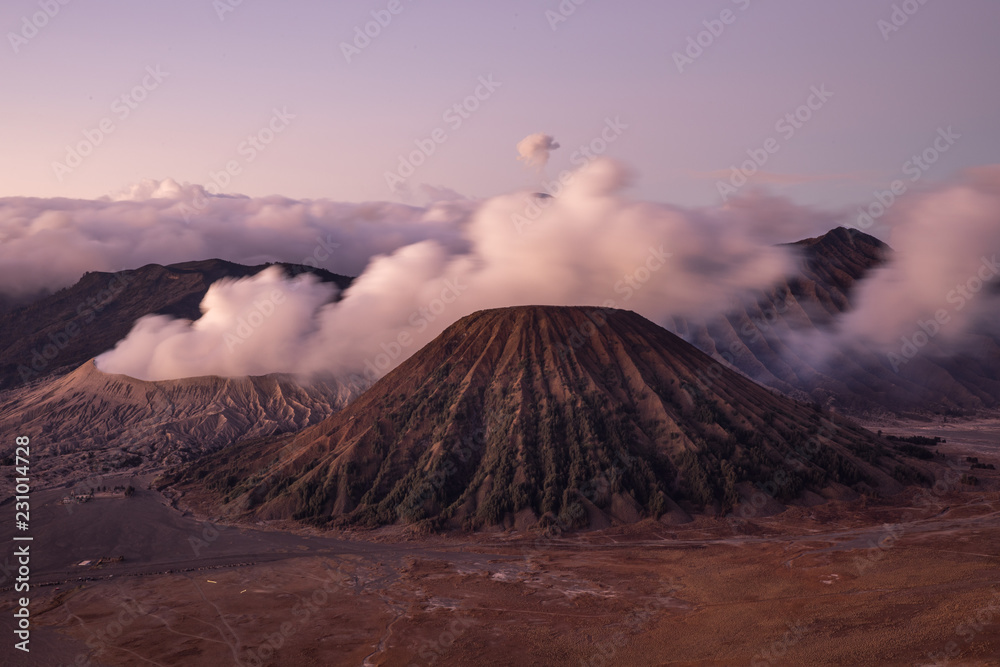 Thick clouds and smoking during sunrise at the Mount Bromo volcano in Java, Indonesia