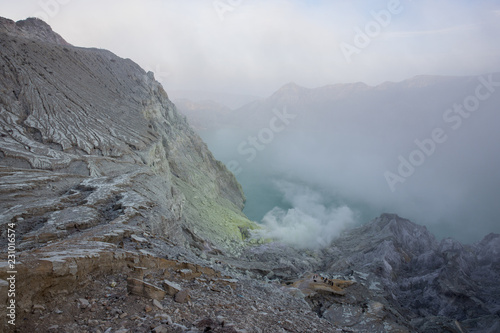 Smoky morning inside the crater of Mount Ijen in East Java, Indonesia