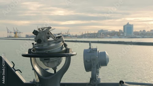 Marine naval gyrocompass on board the ship. Marine compass on the captain bridge of the ship, close-up. Instruments of marine navigation and orientation. photo