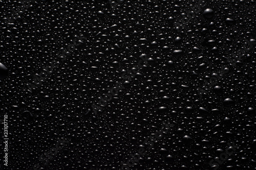 drops of water on a black glass