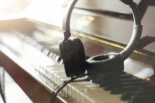 headphones on the piano
