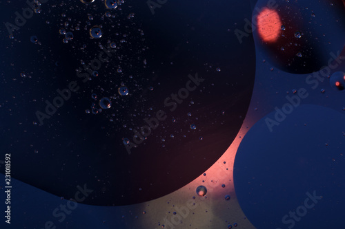 space background. blue and red oil bubbles