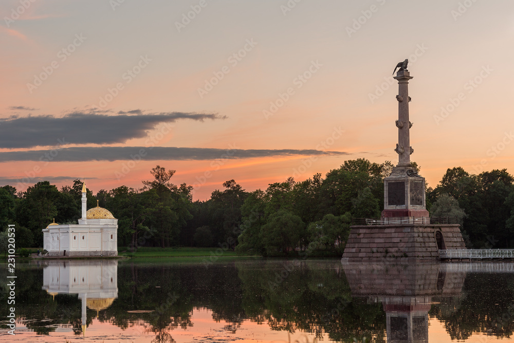Beautiful views of St. Petersburg at sunset with a beautiful warm sky, green forest, calm