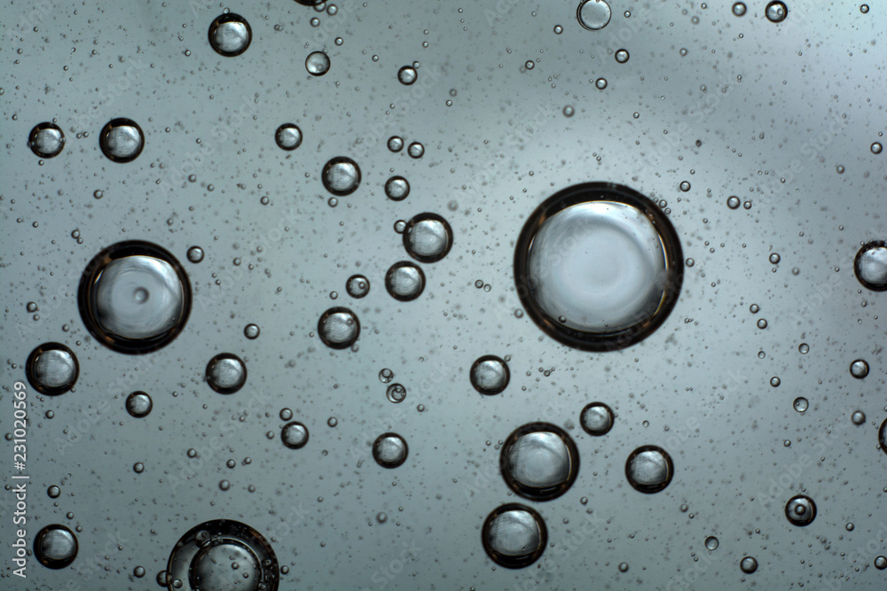 air bubbles in the water. abstract light gray background