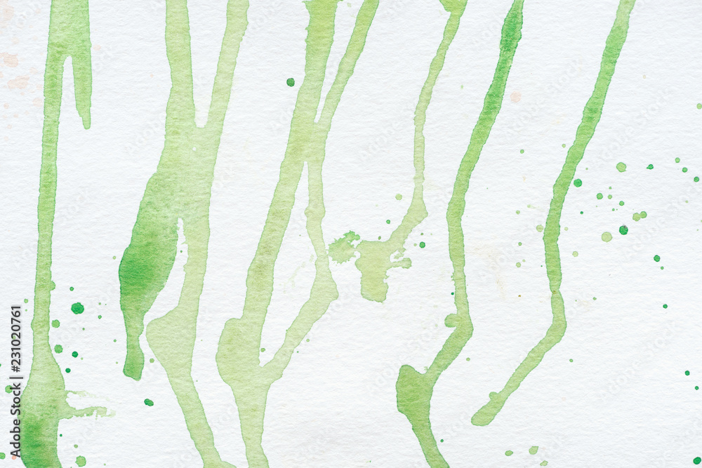 Fototapeta premium abstract green watercolor stains on white paper