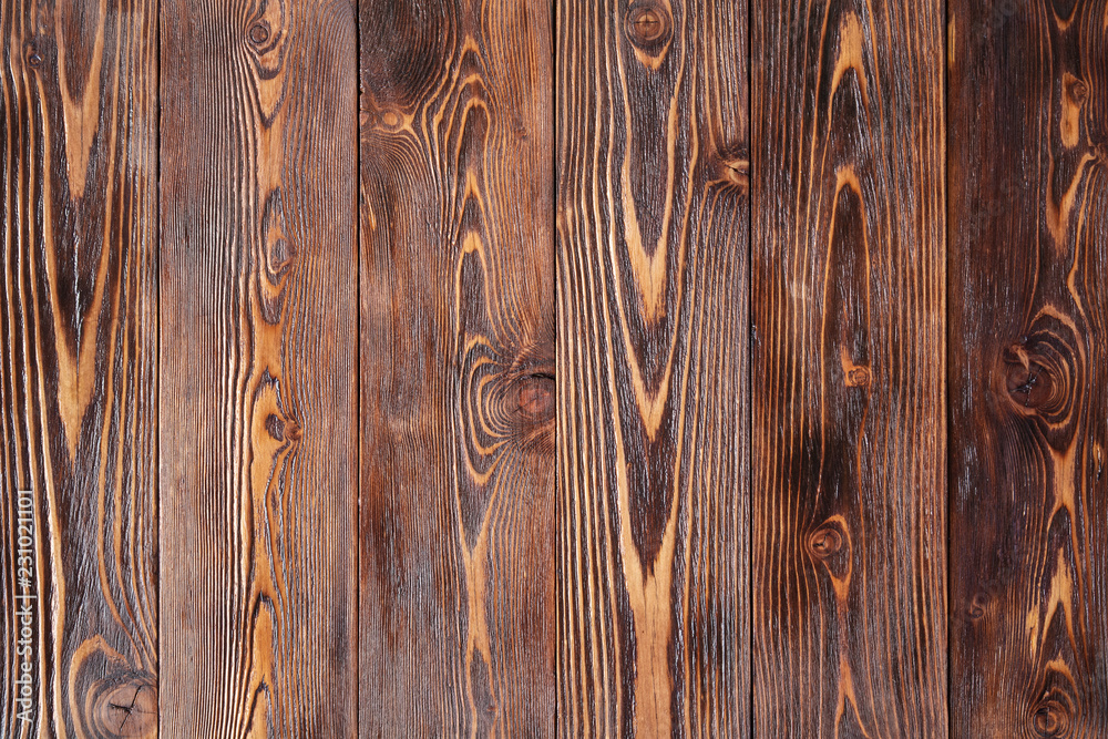 Obraz premium pine boards, covered with stains and varnish, are located vertically. background concept