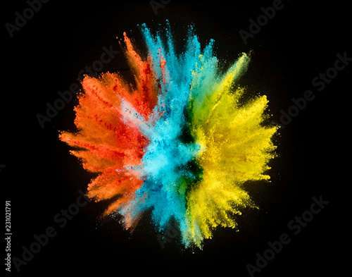 Colored powder explosion on black background