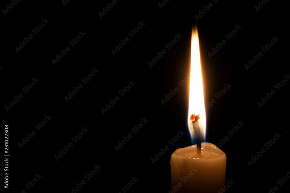 a lonely burning candle in the darkness a lonely burning candle in the darkness