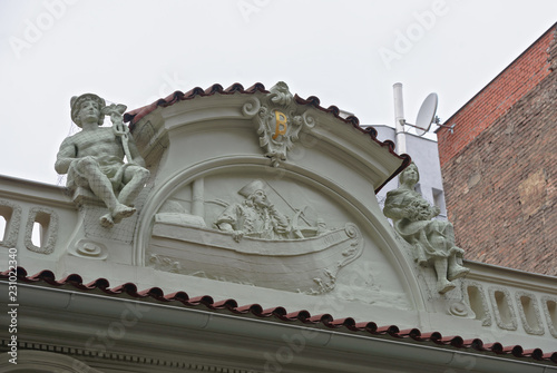 Close-up decorative pediment of old building in Prague, Czech Republic.