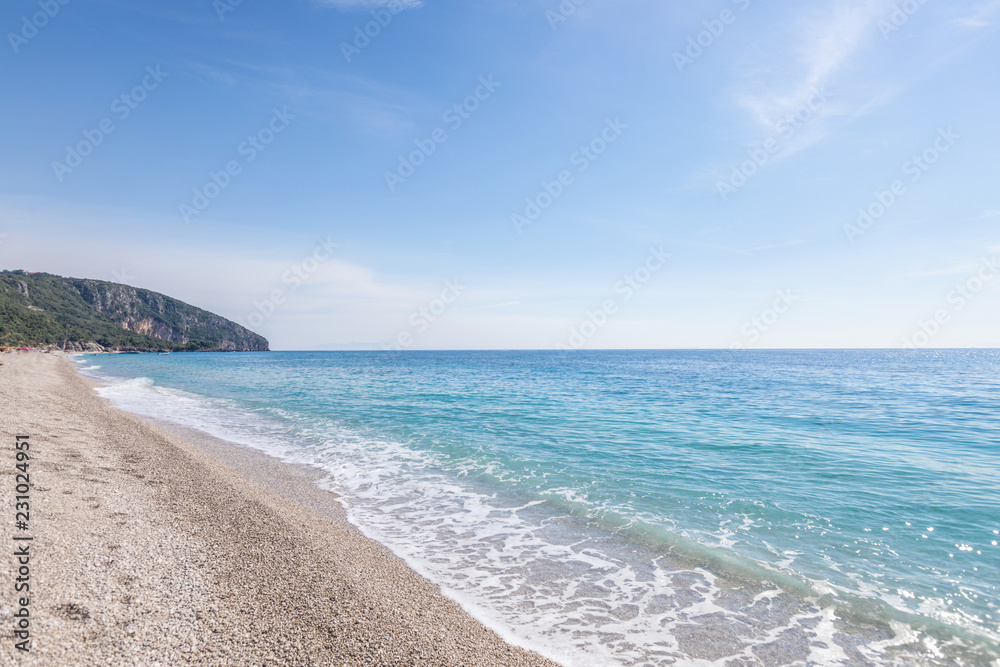 Tropical beach with white pebbles. in Albania.  Ionian Sea