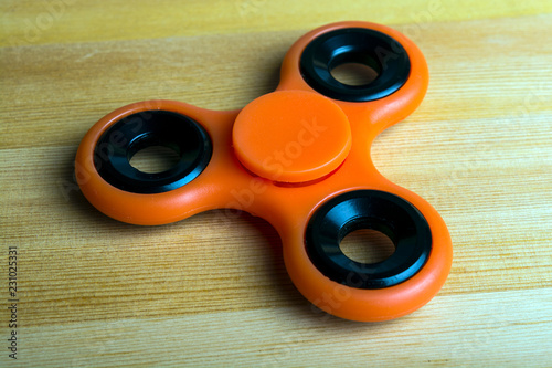 spinner red on a wooden background