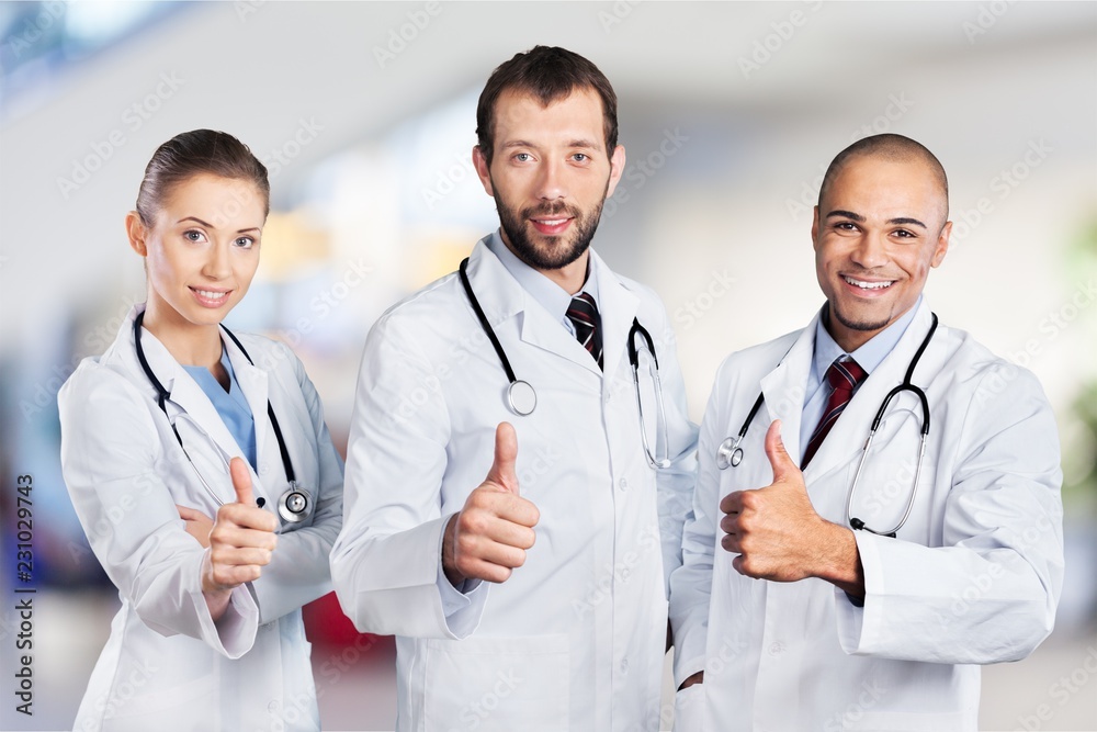 Fototapeta premium Doctors team talking expertise on background