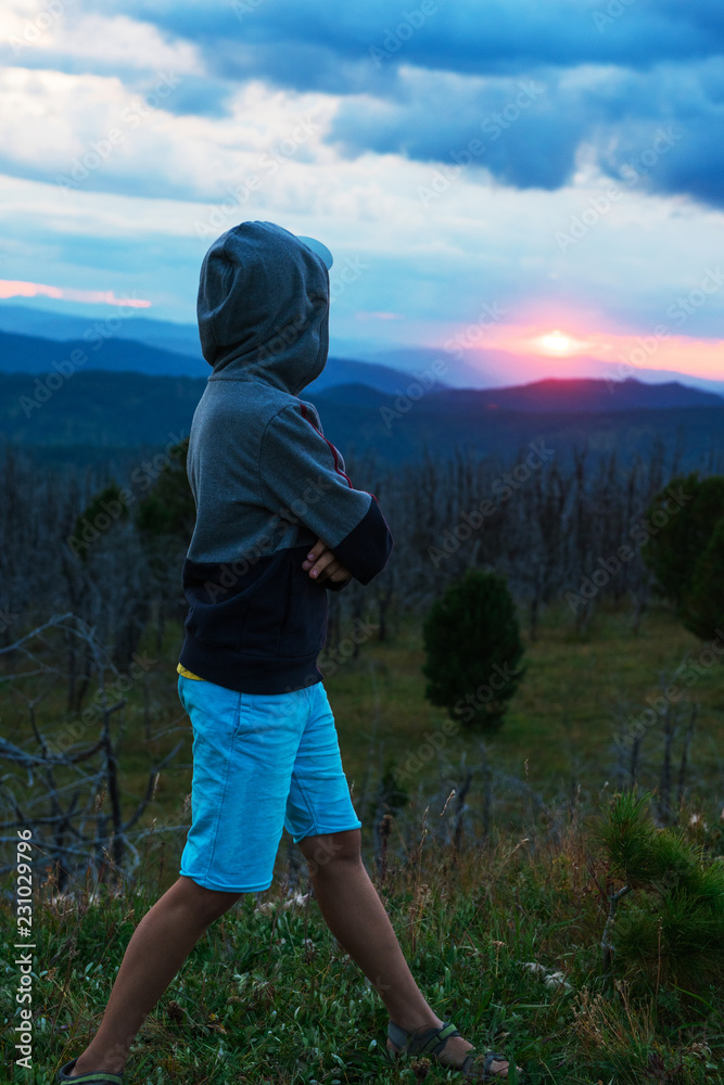 Boy at the evening in Altai mountains Boy at the evening in Altai mountains