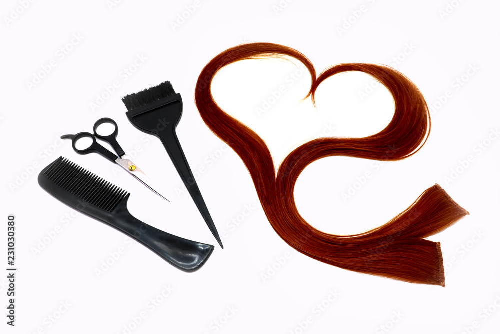 a strand of red hair in the shape of a heart, brushes, scissors and comb , hairdressing tools on a white background, isolated a strand of red hair in the shape of a heart, brushes, scissors and comb , hairdressing tools on a white background, isolated