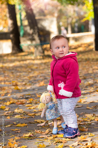 little baby in the park in autumn