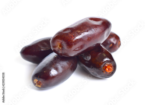 Some raw Dates isolated on white background.
