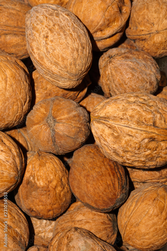 background - natural inshell walnuts