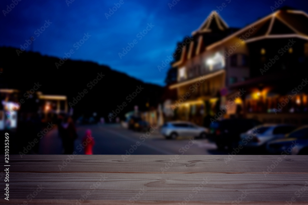 empty table on the night view of street in city background