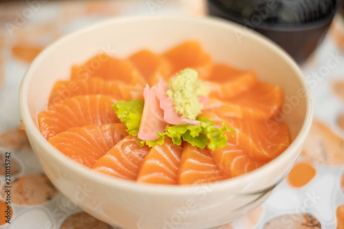 Salmon don - Bowl of steamed rice with salmon sashmi, Japanese traditional food.