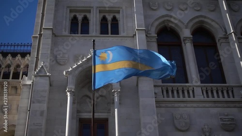 Budapest. Hungarian flag flutters in the wind in slow motion on blue sky see from bottom. Shot in Full HD.