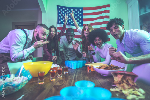A group of young people celebrating and making party at home photo