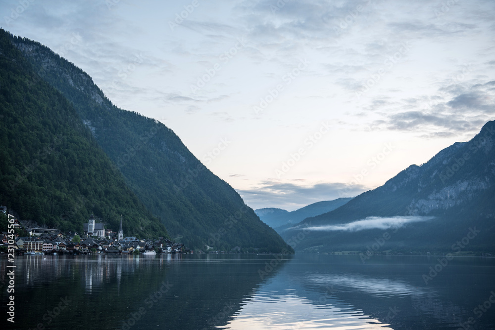 Hallstatt village and Hallstatter See mountain lake at dawn, Austrian alps. Salzkammergut region, Austria. Popular tourist destination