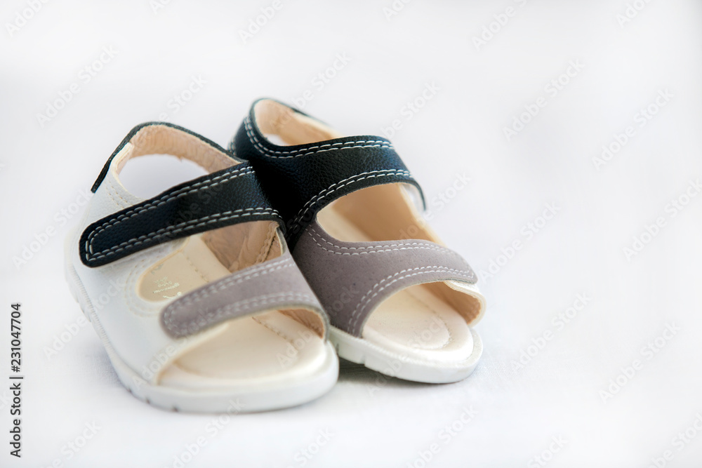 Obraz premium Baby shoes for kids isolated over a white background.