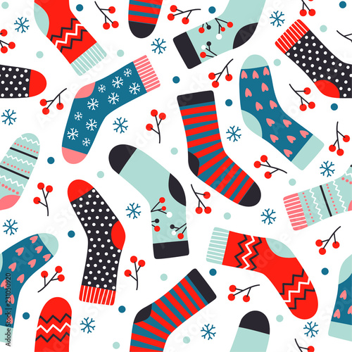 Winter vector seamless pattern with knitted socks, berries and snowflakes.