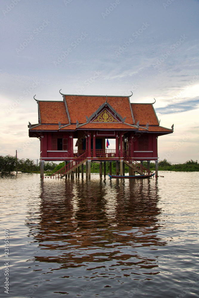 house on the water at sunset in the water village near Kampong plug, Cambodia