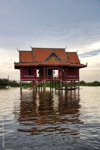 house on the water at sunset in the water village near Kampong plug, Cambodia © raffaellagalvani