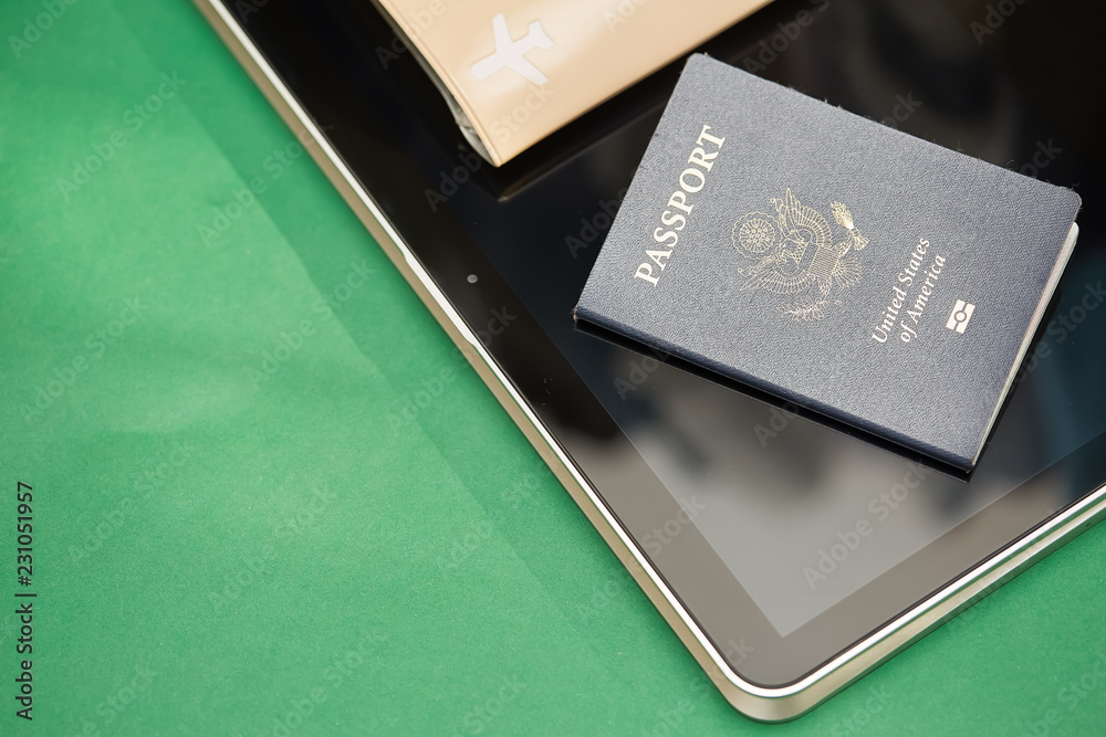 Passport of United States of American. Traveling passport. closeup of an american passport on tablet screen for a travel concept. Passport of United States of American. Traveling passport. closeup of an american passport on tablet screen for a travel concept.