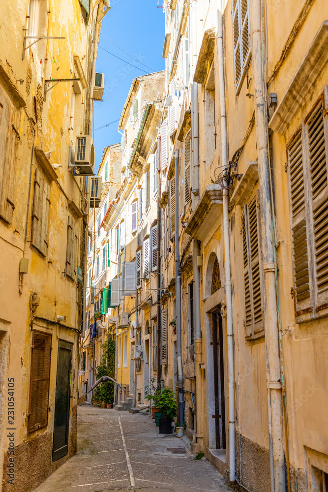 View of typical narrow street of an old town of Corfu in Greece