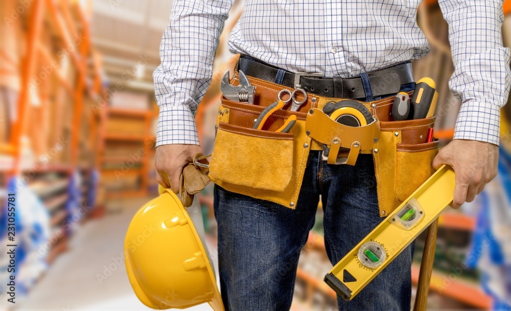 Worker with a tool belt. Isolated over Worker with a tool belt. Isolated over