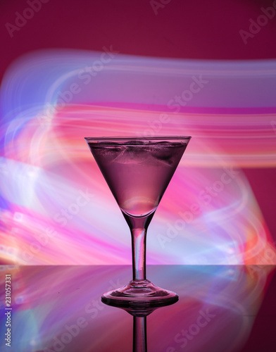 Martini glass on the background of neon lights