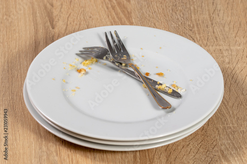dirty plate with fork and knife © Markus