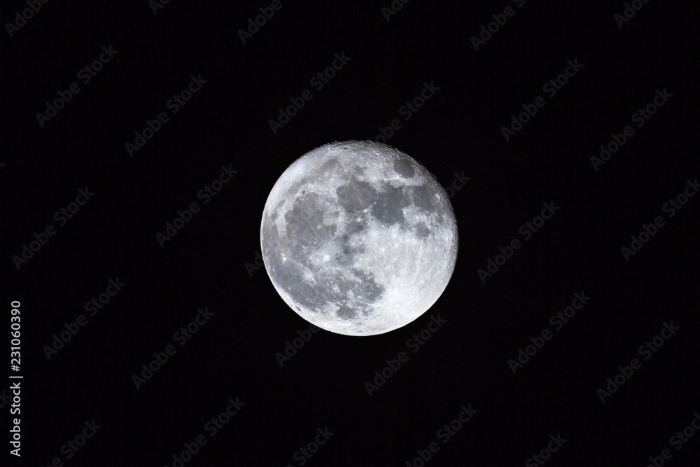 full moon over dark black sky background at night. Lunar perigee super moon coincidence of a full moon with the closest approach to the Earth. Copy space center. full moon over dark black sky background at night. Lunar perigee super moon coincidence of a full moon with the closest approach to the Earth. Copy space center.