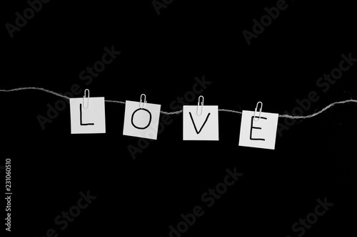 The word love on black background