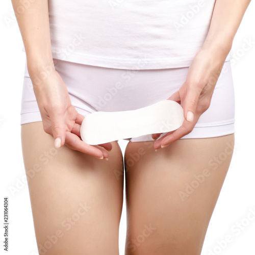 Woman female body hygienic napkin menstruation in hand on white background isolation