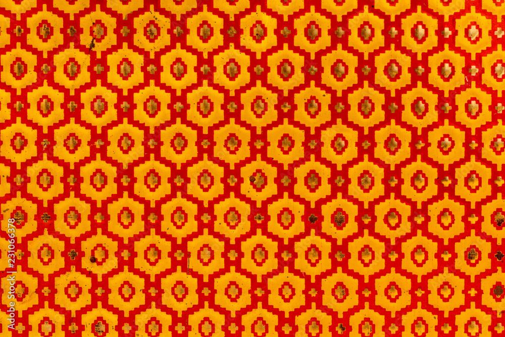 Metallic texture of red and yellow hexagons. Pattern. Retro look, old and shiny. Metallic texture of red and yellow hexagons. Pattern. Retro look, old and shiny.