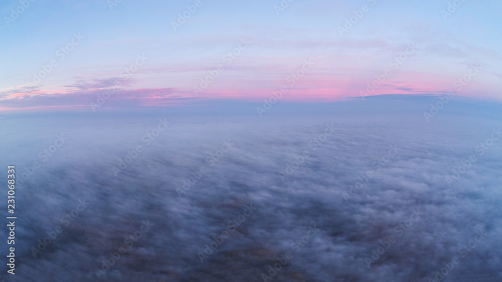 Dawn above clouds
