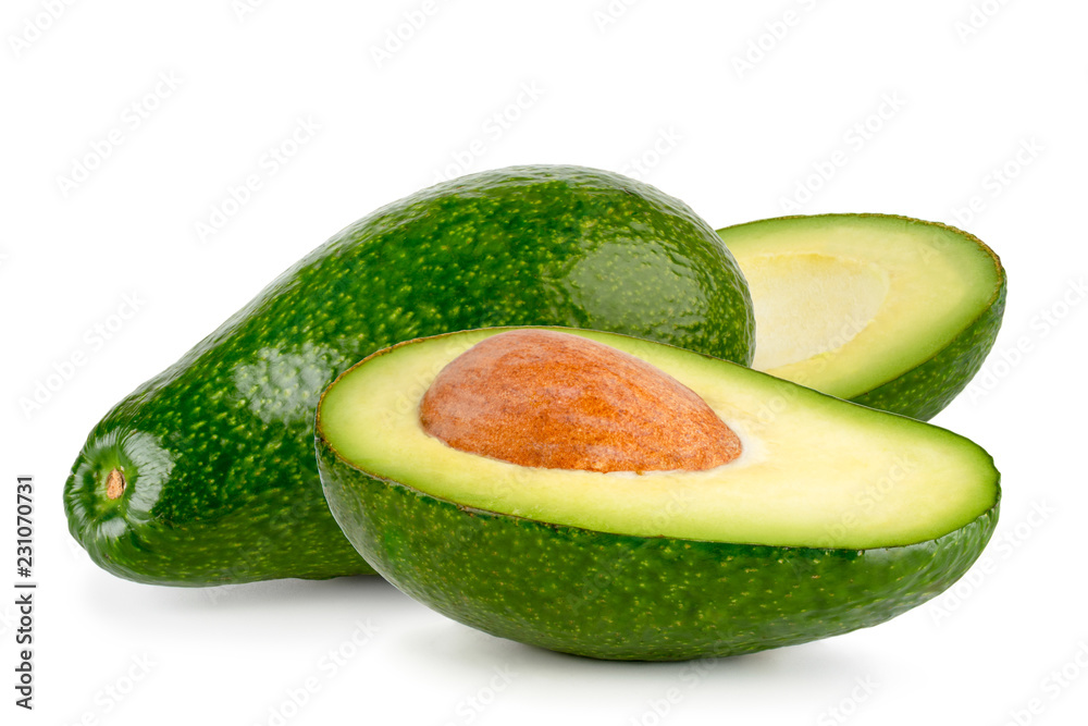 Avocado and two halves close-up on a white. Isolated. Avocado and two halves close-up on a white. Isolated.