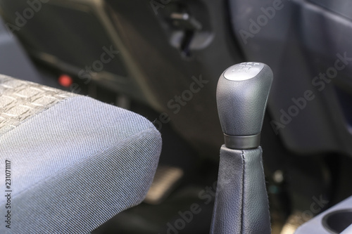 Driver's place of a bus with gearbox handle under the frontground photo