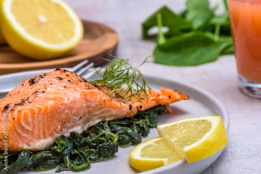 Baked salmo trutta on spinach - healthy food Baked salmo trutta on spinach - healthy food