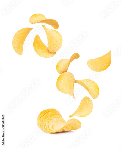 Potato chips rise up from the pile with chips, isolated on a white background photo